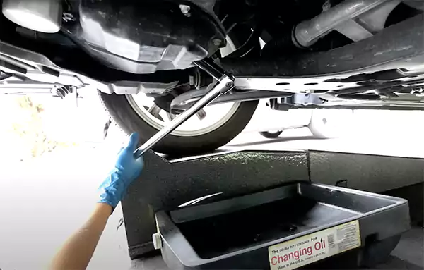 Loosening the drain plug