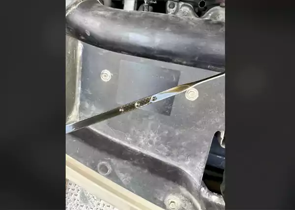 Three holed engine oil dipstick